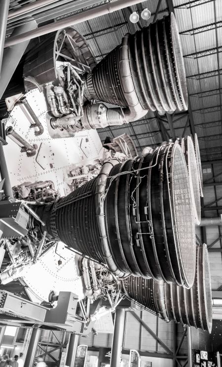 The bottom end of a Saturn V is a thing that is difficult to come to terms with, even as you are staring directly at it. There are people in the very lower left corner of this image to give a sense of scale, but the human mind refuses to accept it. And the fearsome power of this machine is something that the human mind cannot even conceive of, let alone decide whether to accept it or not. It is beyond the ken of sensible understanding.
